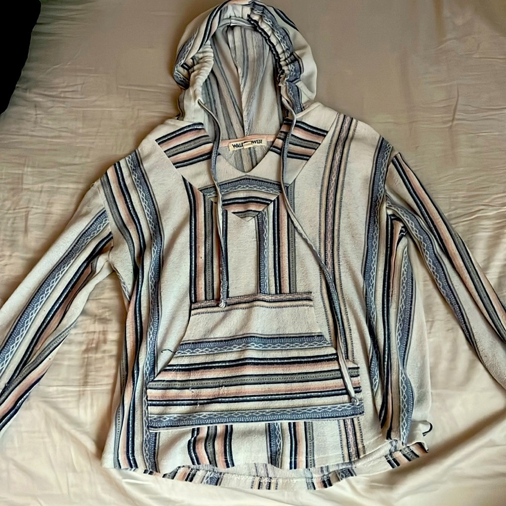 Mostly white with some pink, orange, and different shades of blue. Medium.